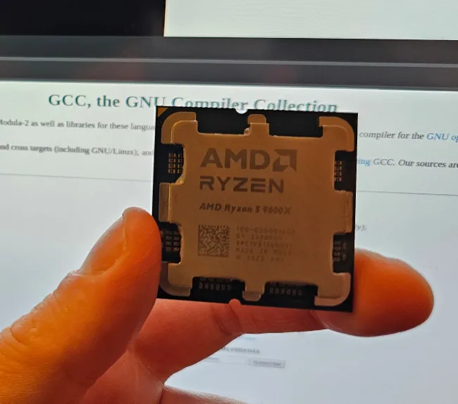 Ryzen Zen 5 CPU with GCC site in background